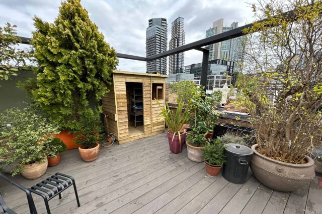 Flat roof conversion terrace garden builder Shoreditch London, installing a structure with structural joists & treated structural steels.