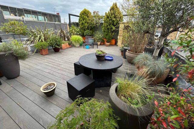 Flat roof conversion terrace garden builder Shoreditch London, installing a structure with structural joists & treated structural steels.