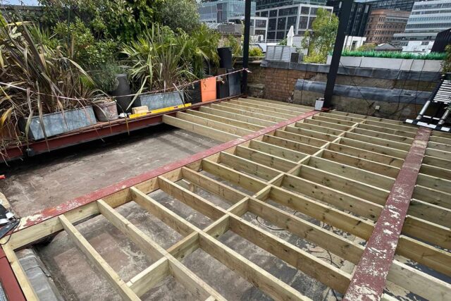 Flat roof conversion terrace garden builder Shoreditch London, installing a structure with structural joists & treated structural steels.
