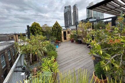 Flat roof conversion terrace garden builder Shoreditch London, installing a structure with structural joists & treated structural steels.