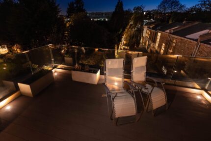 Stunning hardwood roof terrace installation with glass balustrades in Highbury London.